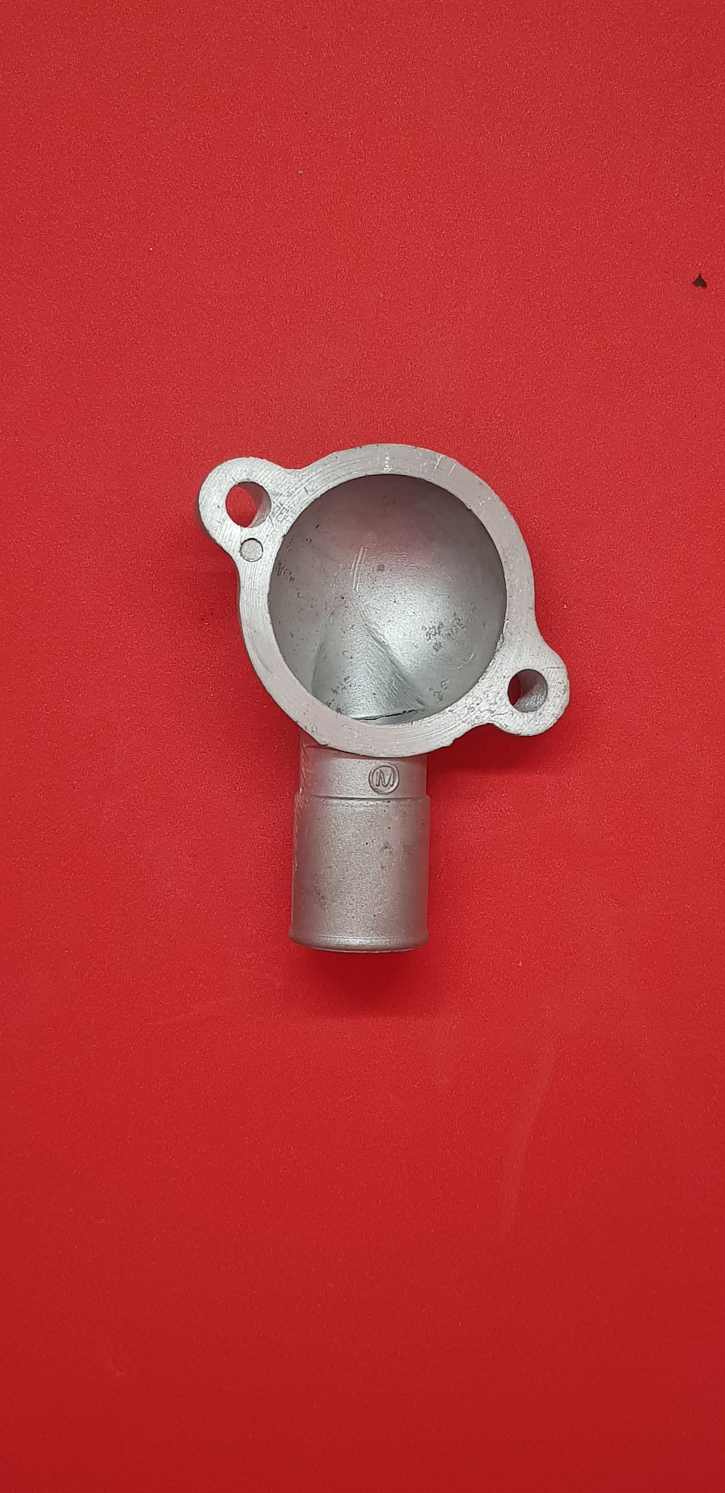 F10A Engine thermostat cover.